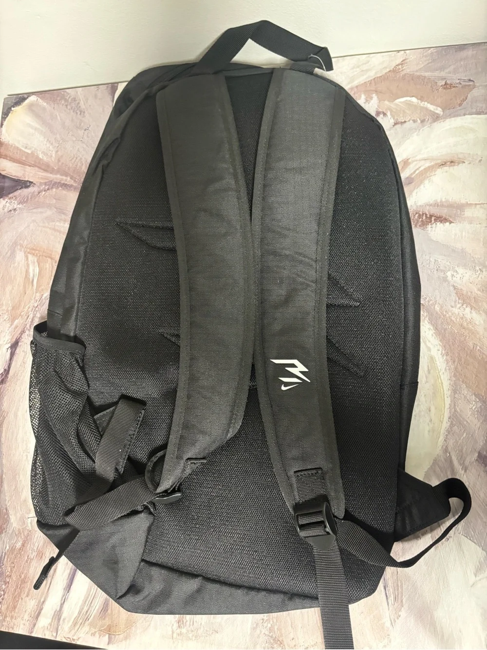 Nike Black Backpack with White Swoosh and Graphic